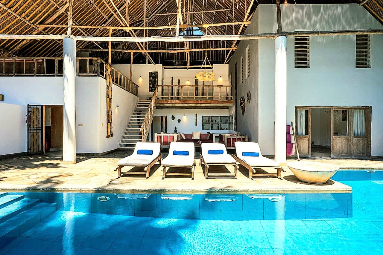 large roofed terrace overlooking the pool