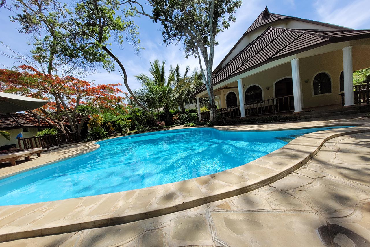 Villa with pool under blue sky in Diani Beach